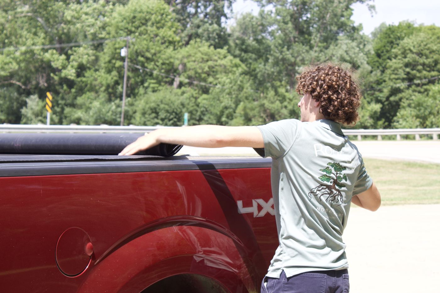 Rooted crew member loading the truck