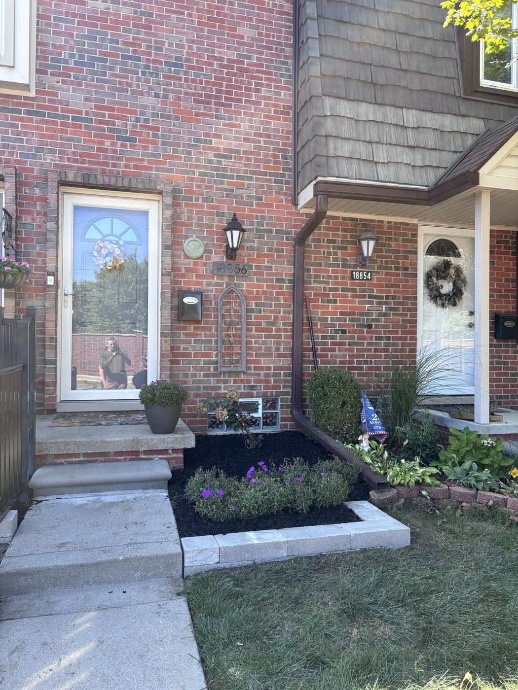 Townhouse entry with new paver-bordered flower bed